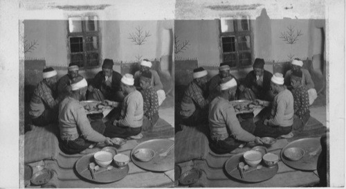 Turkish travelers at supper in a village rest house, Derbe. Biblical Asia Minor