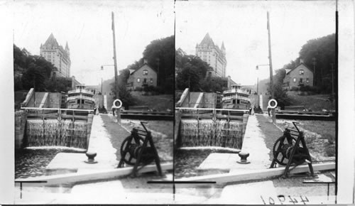 Boat Locking Down Rideau Canal, Chateau Laurier in Background. Ottawa. Ont