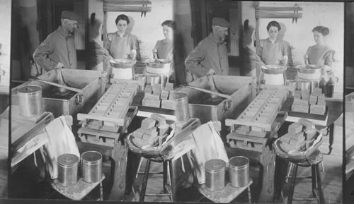 "Stirring off" maple sugar, filling cans and moulding cakes of sugar for market. Vermont