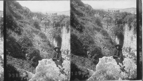 Old Spanish Aqueduct made of still older Inca stones, an Andean mountainside at Cuzco. Peru