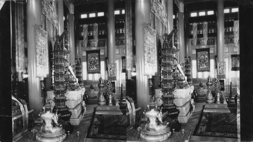 Interior of Chinese Lama Temple, Chicago, Ill, Side view along front row, showing the Central Figure (Avalokitecvara, whose incarnation was Dali Lama in Lhasa, the Patron Saint of Tibet) flanked by Pagodas and fronted by many Lamanistic symbols and sacrificial gifts