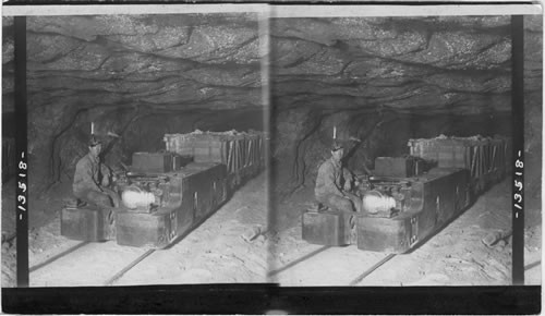 A Motor drawing a train of loaded salt cars in the depths of the Great Retsof Salt Mine, Retsof