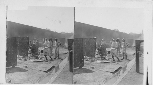 Preparing a body for burning - Hindu burning place. Bombay, India