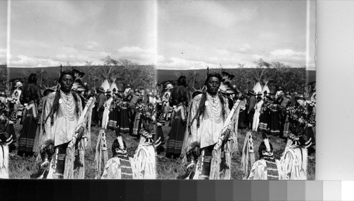 Chief Two Guns White-Calf -(chief two guns not the model chosen), and other Blackfeet Indians. Glacier National Park, Montana