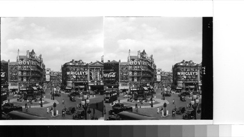 London: Piccadilly circus looking toward Shaftsbury Avenue, on of the several streets leading out of the Circus." The famous fountain with the state of Eros atop Centes octagonal center of the "Circus."