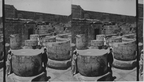 Stumps of gigantic columns in wall adjoining the temple’s treasury - Medinet Habu, Egypt