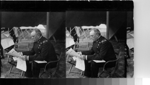 General Corbin, Chief in command, reading accounts of the maneuvers in the newspaper