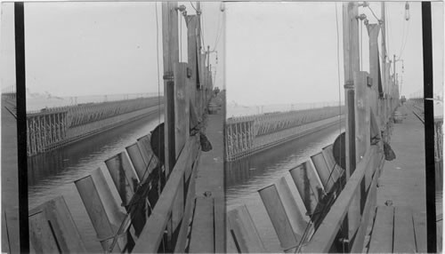 N.E. from Chicago & N. Western Ave Dock #6 with ore - spouts in foreground. Docks #5 in middle ground. North Escanaba, Mich