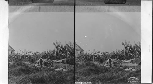 Gen. Anderson viewing insurgent dead, Philippine War. War view, 1899 (E.E. Baker)