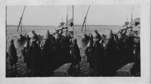 Egyptian women with their water Jars on the Banks of the Nile