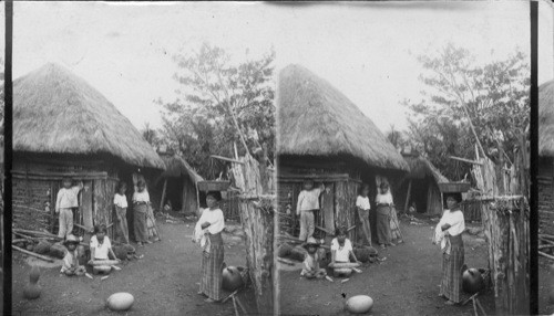 Beneath the low thatched roof, Santa Maria, Guatemala. C.A