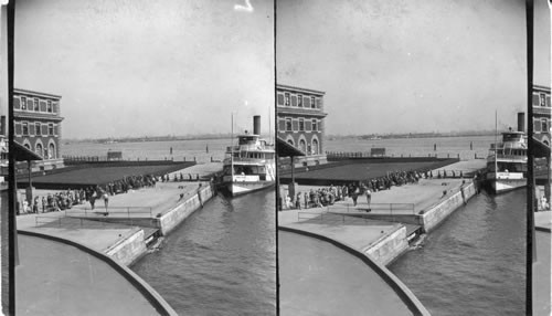 From Boat Looking To Ellis Island Immigration Bldg. and Immigrants arrived from Europe. [Replaces Dept. E. #32 (16752)]