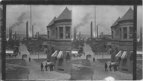 View down street of steel town near Pittsburgh, Pa. Main entrance to Homestead Steel Works, looking past the office