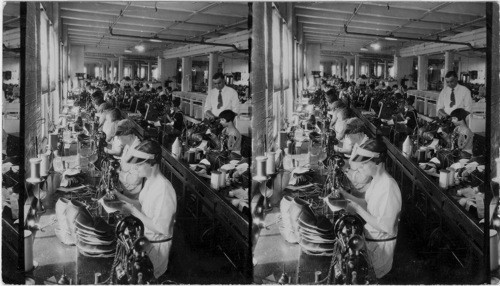 General view of stitching & fitting dept. in a large men shoe factory, (Nettleton Shoe Co. Syracuse) replaces #(41)22190) Dept. E.) Syracuse, N.Y. In this room many more operations are performed beside stitching - perforating - pinking is done. Eyelets are put on shoes - straps also, ect