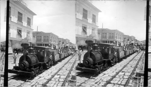 How imported goods are carried from Custom House - railway along street in Guayaquil. Ecuador