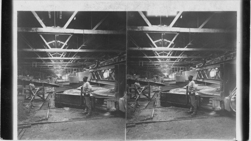 Glass-making Tarentum - revolving iron disks grinding surface of plate glass. Tarentum. Pa