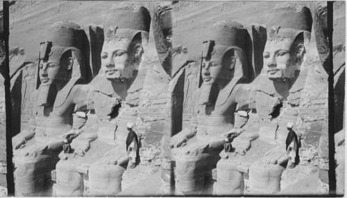 The sixty-five-foot portrait statue of Ramses II before rock-hewn temple of Abu Simbel. Egypt