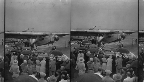 Loading Passengers for the First Airplane Journey of the Pennsylvania - Santa Fe Air-Rail Service. Columbus, Ohio, July 8, 1929. First Pennsylvania - Santa Fe Air-Rail Transcontinental Tri-motored Plane Leaving Columbus, Ohio. July 8, 1929