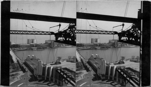 Construction is being rushed for the opening of the World's Fair, June 1st. Looking from the 240 foot level of the western skyride tower eastward across the lagoon to the Electrical Unit Buildings, below the North Colonnade of the Hall of Science and the circular opening for the ornamental fountain fronting it, Century of Progress, Chicago, Ill