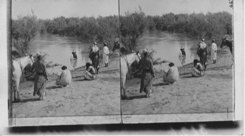 Baptizing in the Jordan. Palestine