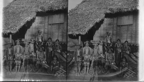 Datto Bulau, the longhaired chief and a group of his Bagolan subjects of Isle de Mindanao. Moros. Baker's classification