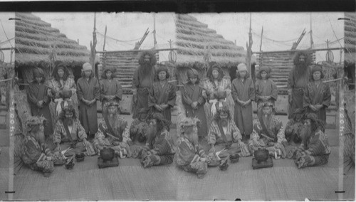 Ainu men, the aborigines of Japan in feast attire, Island of Yezo, Japan