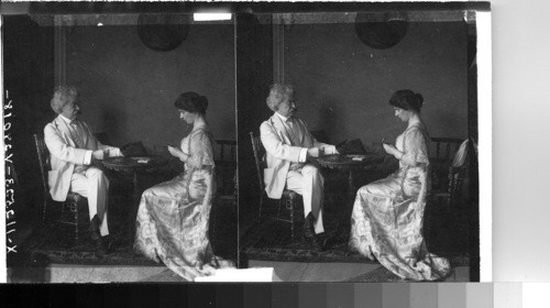 Mark Twain and daughter playing cards