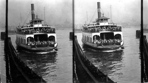 Ferry boat coming into Hoboken. Carrying a load of commuters