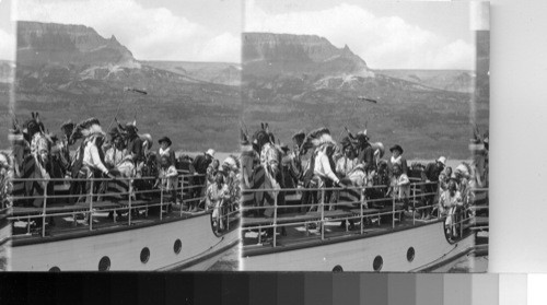 Blackfeet Indians, including Chief Two Guns White-Calf enjoying a boat ride. Glacier National Park, Montana