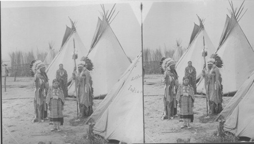 Indians with feather headdresses in front of tents. St. Louis World's Fair, Missouri