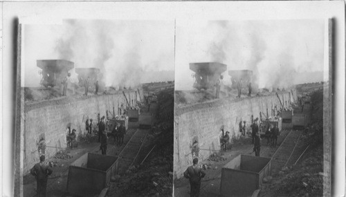 Coke ovens near Altoona filling with soft coal from overhead - opening and sealing doors. Pittsburgh, Penna