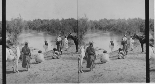 Baptizing in the Jordan. Palestine