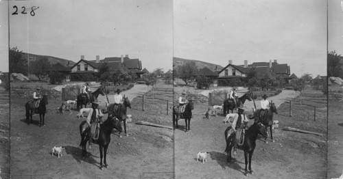 Cowboys and ranch house in Texas