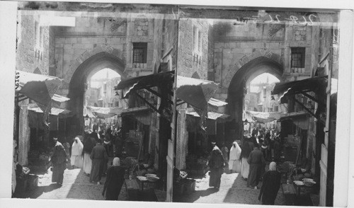 The crowded Bazaar and thoroughfare of David St., Jerusalem. Palestine