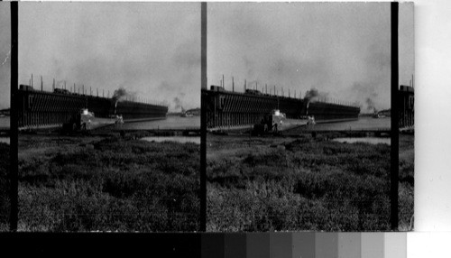 Loading ore boat at dock at Duluth, Minn