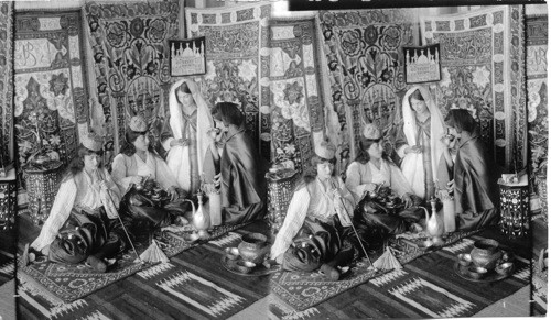 The long stemed pipe - Turkish girls at home smoking, gossiping and reading poetry, Turkey