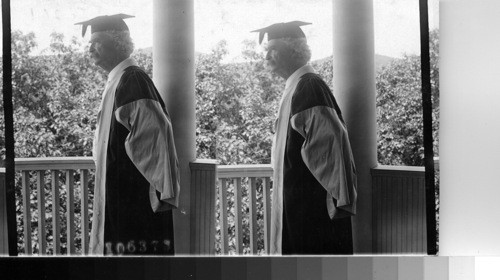 Mark Twain in college cap and gown. S.L. Clemens