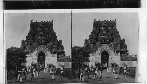 Guardian of Hindu mysteries - S.W. to gateway and sculptured temple tower. Tanjore, India