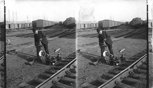Yard man placing switch lamps. D.L. and W.R.R. New Jersey