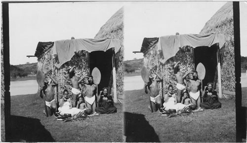 Group of natives eating poi in the old fashioned style - Hawaiian Islands