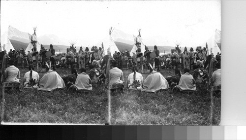 Chief Two Guns White-Calf and a Circle of Blackfeet Indians Listening to Music. Glacier National Park, Montana