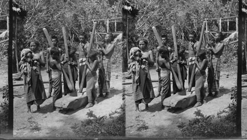 Moro Children Hulling Rice, Philippines. (Moros of Mindanao - E.E. Baker)