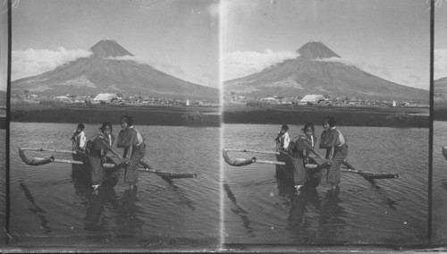 Mayon (volcano) showing Filipino boat with outriggers, Philippines