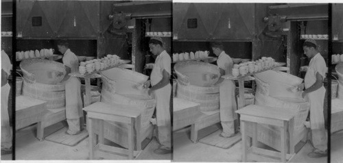 "Applying glaze to bisk" All ware is called "bisk" before it is glazed. "Lenox, Inc." Makers of fine chinaware, Trenton, N.J