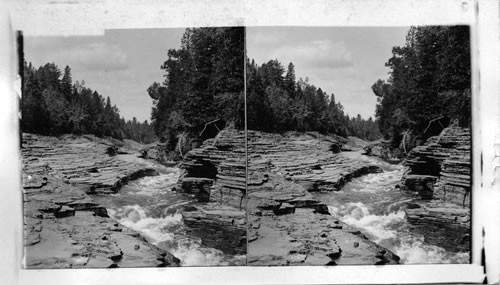 Famous natural steps and hurrying stream above the Falls of Montmorency, near Quebec. Canada