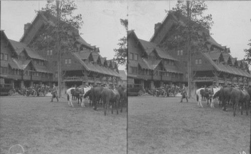 Auto Bus Leaving Old Faithful Inn Showing Saddle Horses Waiting for Party