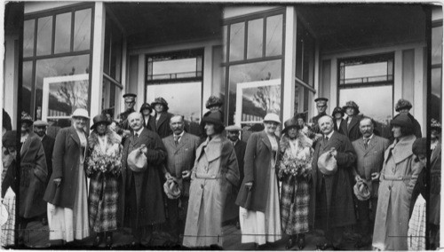 Mrs. Pullen standing beside Mrs. Harding, Gov. Bone at her left, Wrangell, Alaska. No title. Mrs. Harding or an Alaskan reception committee