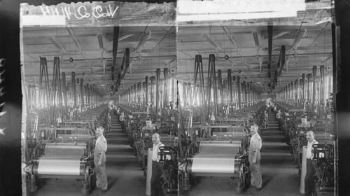 Weaving plain silk cloth, hundreds of automatic looms in a modern American silk mill. Paterson, N.J