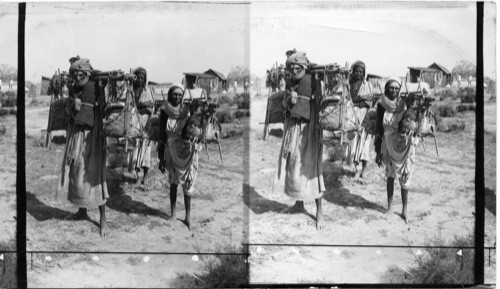 Water carriers conveying the sacred water of the Ganges to the Temples, India