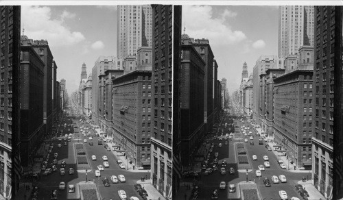 Park Avenue, New York City, looking uptown from New York Central Bldg. shows residential bldgs. and hotels. World famous Waldorf Astoria Hotel shown in right center of picture